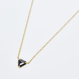 Triangular black diamond necklace in 18ct yellow gold.