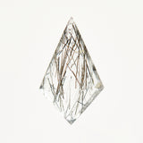 Unique kite-shaped rose-cut rutilated quartz gemstone.