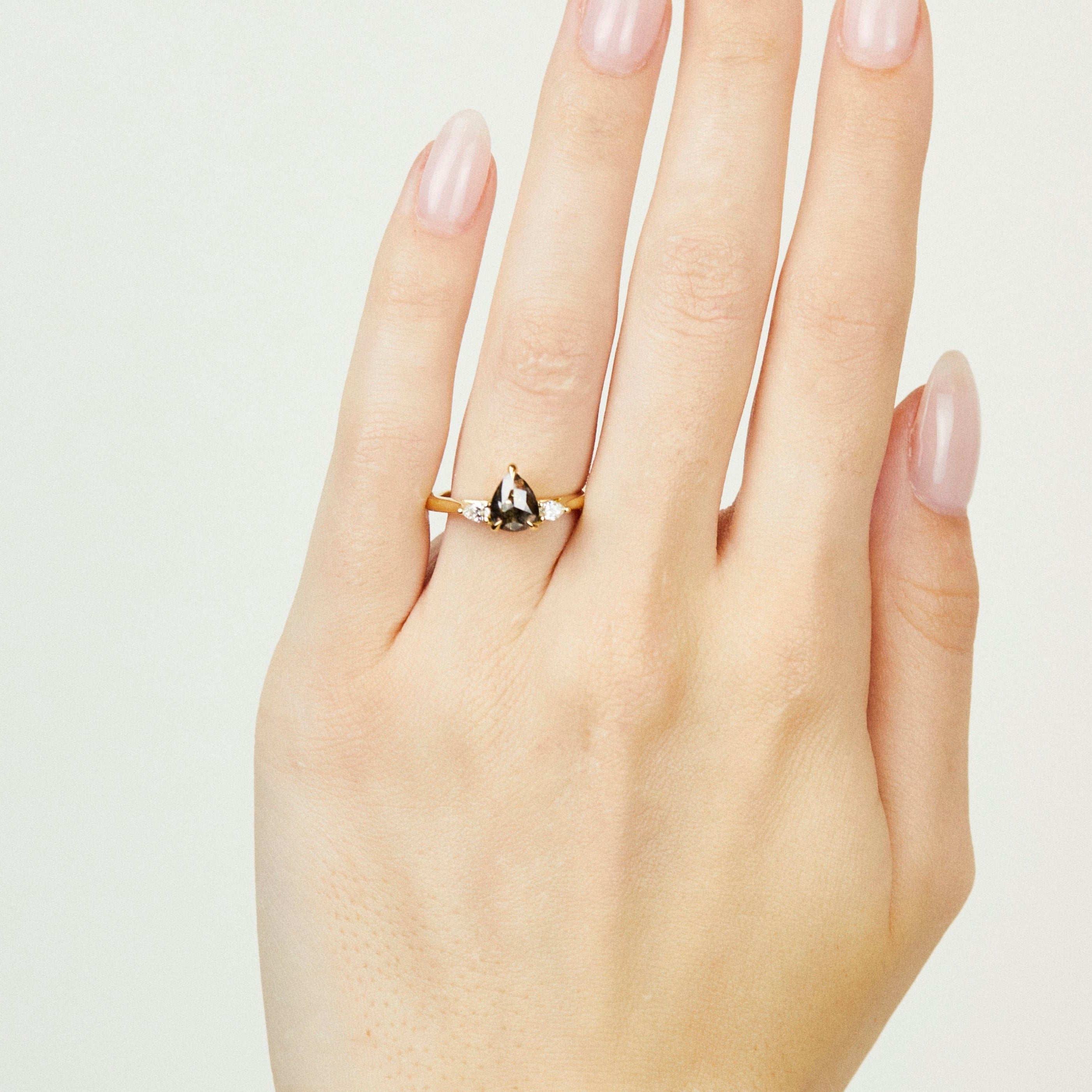 18ct yellow gold salt and pepper pear diamond engagement trilogy ring