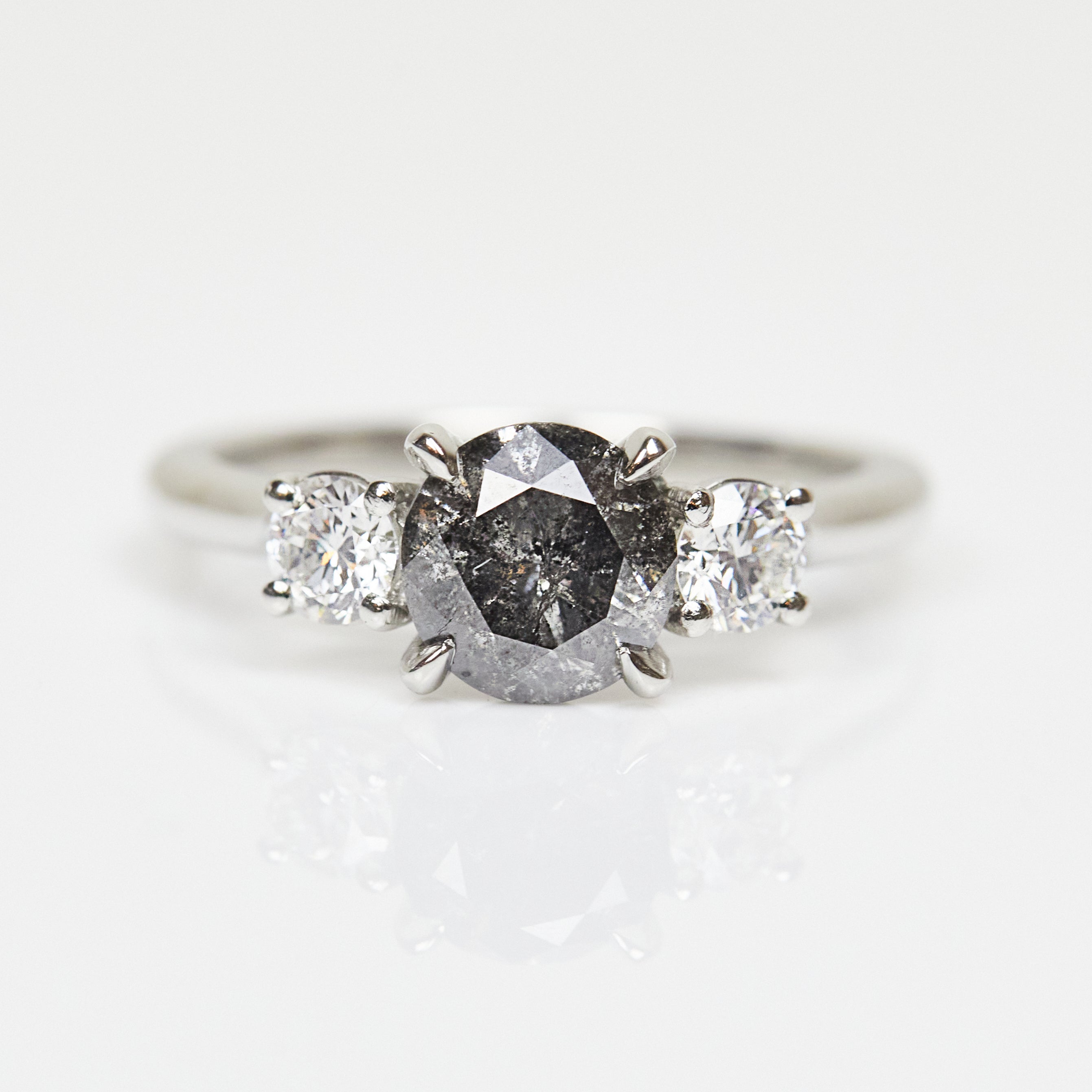 Platinum salt and pepper round brilliant cut diamond engagement trilogy ring