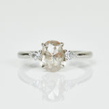 Platinum salt and pepper oval diamond engagement trilogy ring