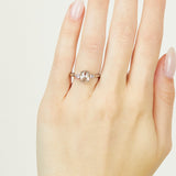Platinum salt and pepper oval diamond engagement trilogy ring