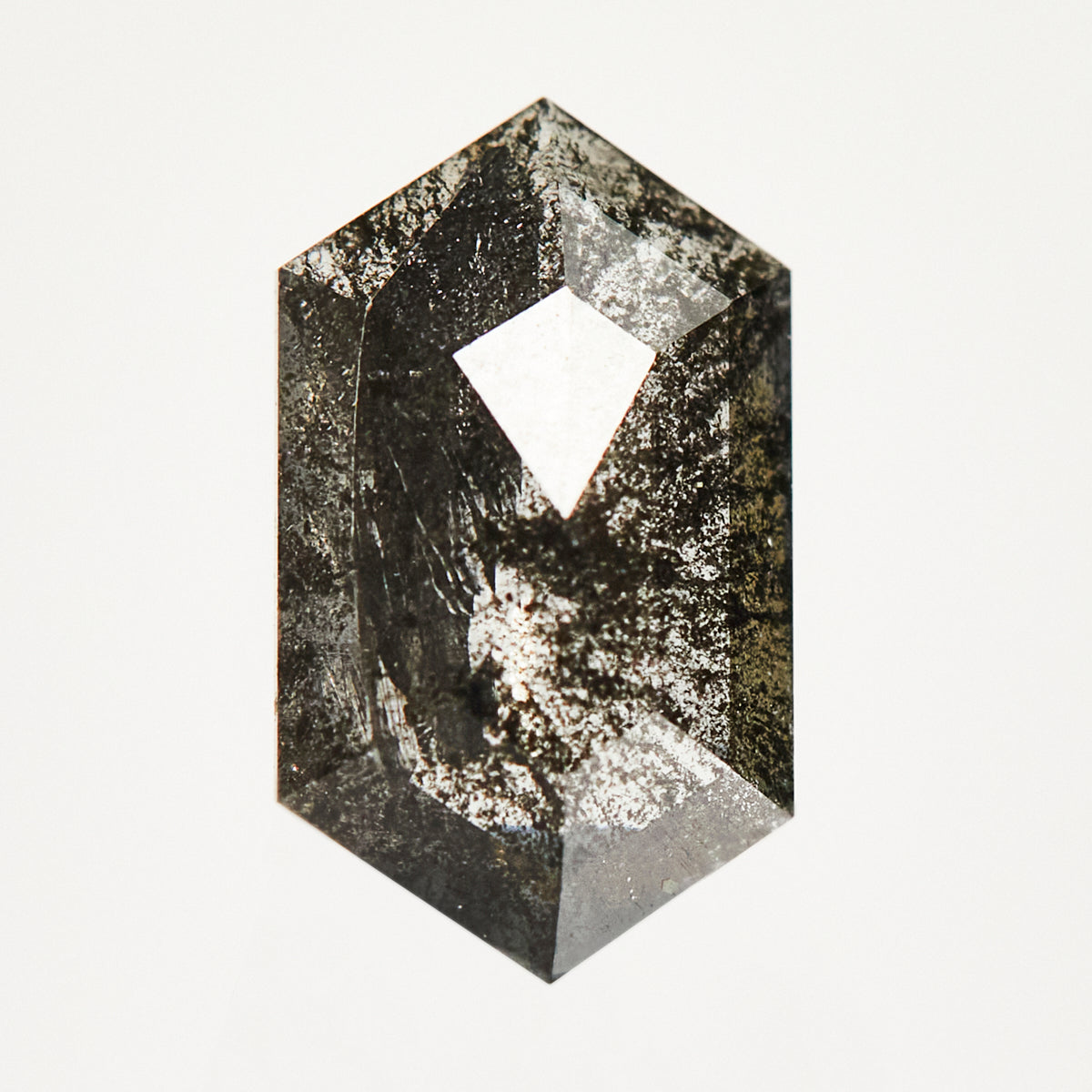 Elongated hexagon rose-cut black salt and pepper diamond.