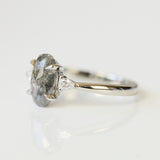 Platinum oval salt and pepper diamond trilogy
