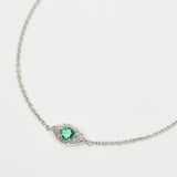 Green sapphire evil eye bracelet with diamonds in 18ct white gold.