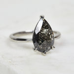 Platinum salt and pepper pear diamond engagement solitaire ring
