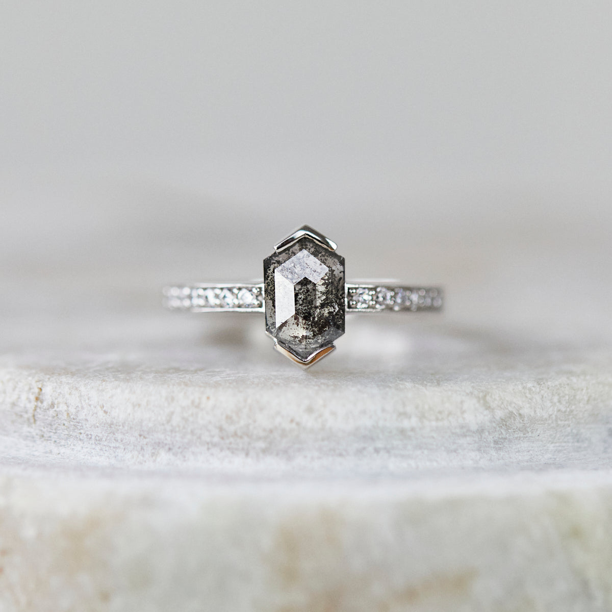 Platinum salt and pepper hexagon diamond engagement pavé ring