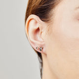 Salt and pepper crescent moon diamond earrings in yellow gold.