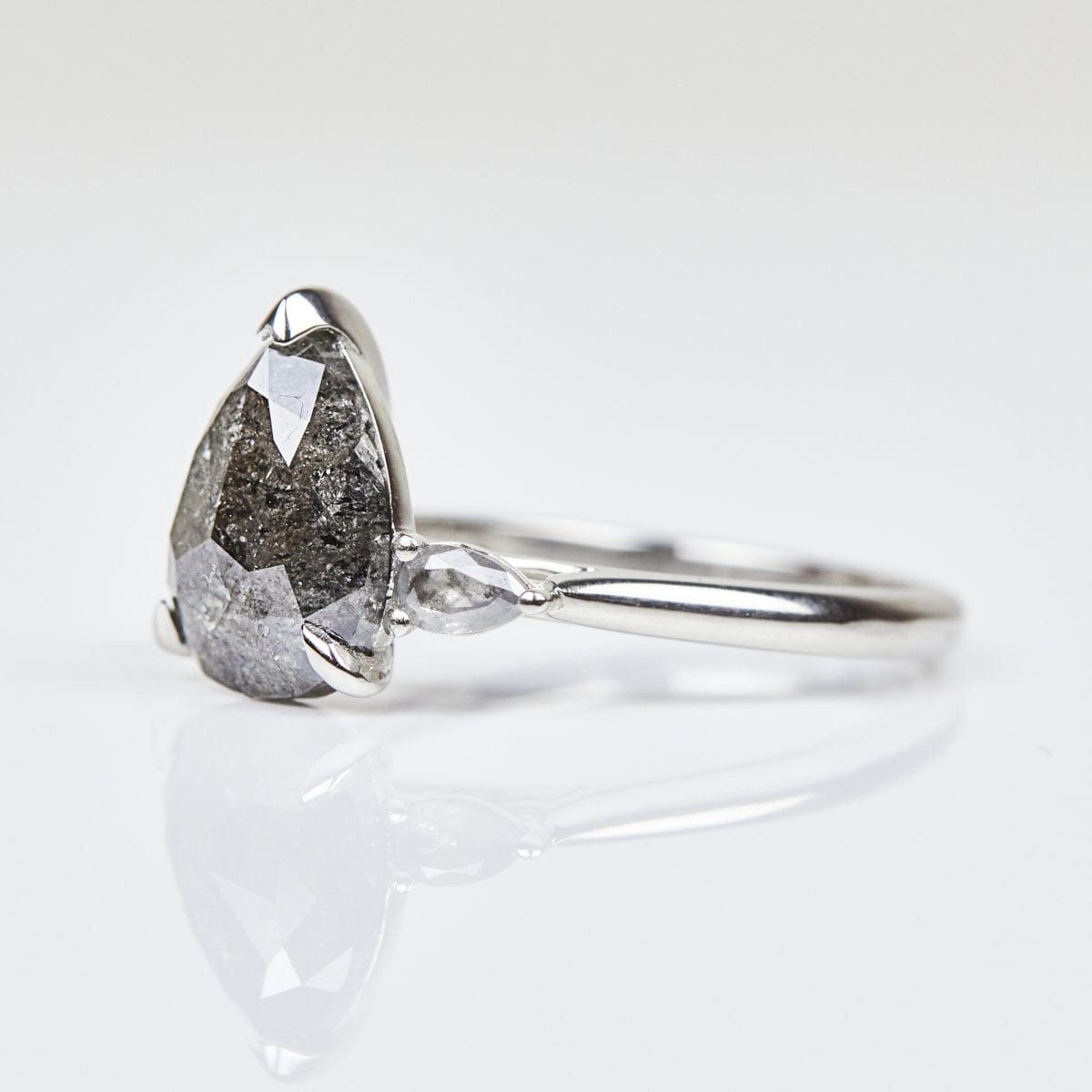 Platinum salt and pepper pear diamond engagement trilogy ring