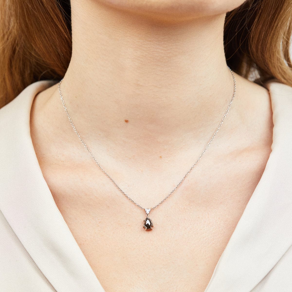Black triangular salt and pepper diamond necklace in platinum.