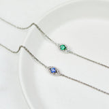 Green sapphire evil eye bracelet with diamonds in 18ct white gold.