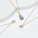 Oval transparent salt and pepper diamond necklace in 18ct yellow gold.