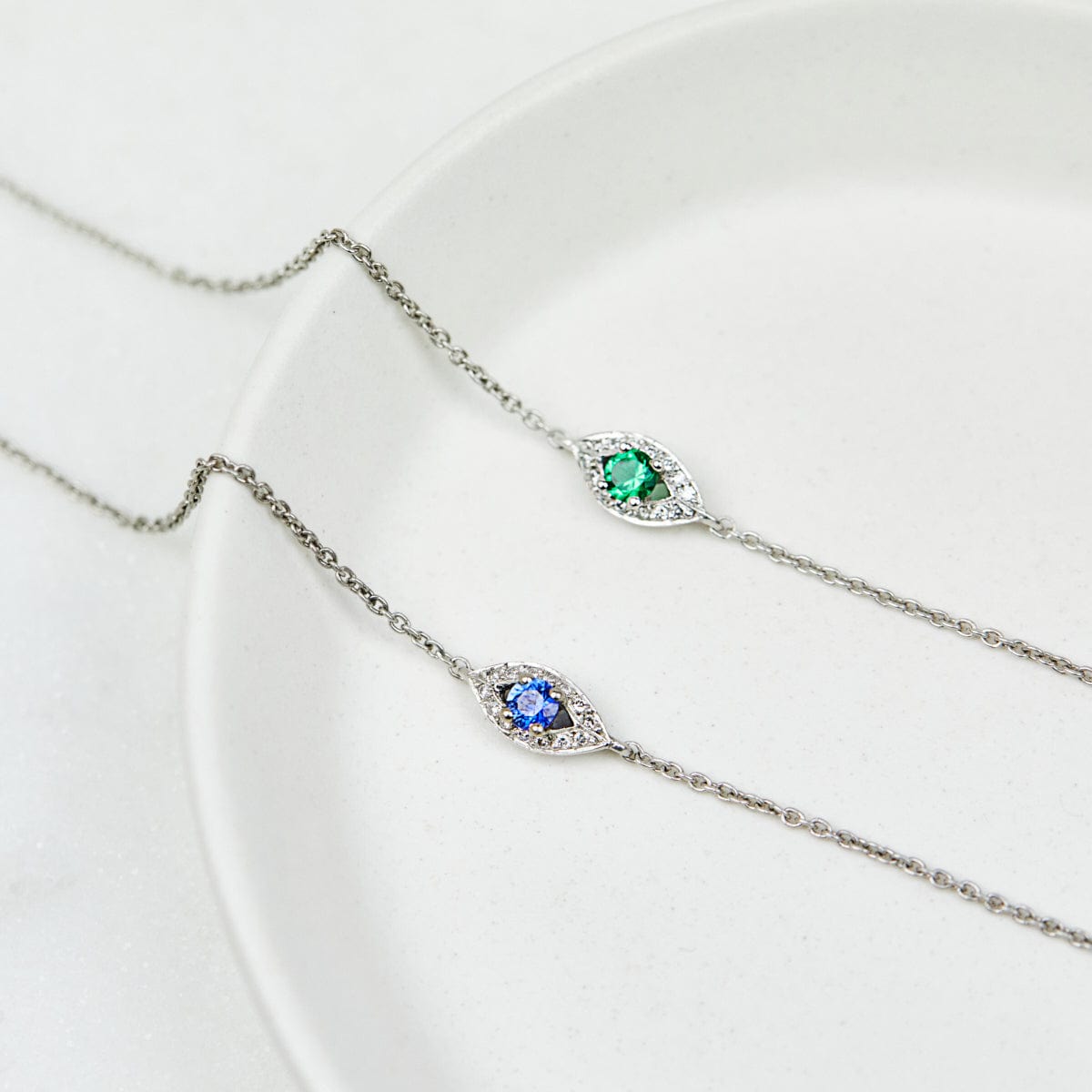 Sapphire evil eye bracelet with diamonds in 18ct white gold.