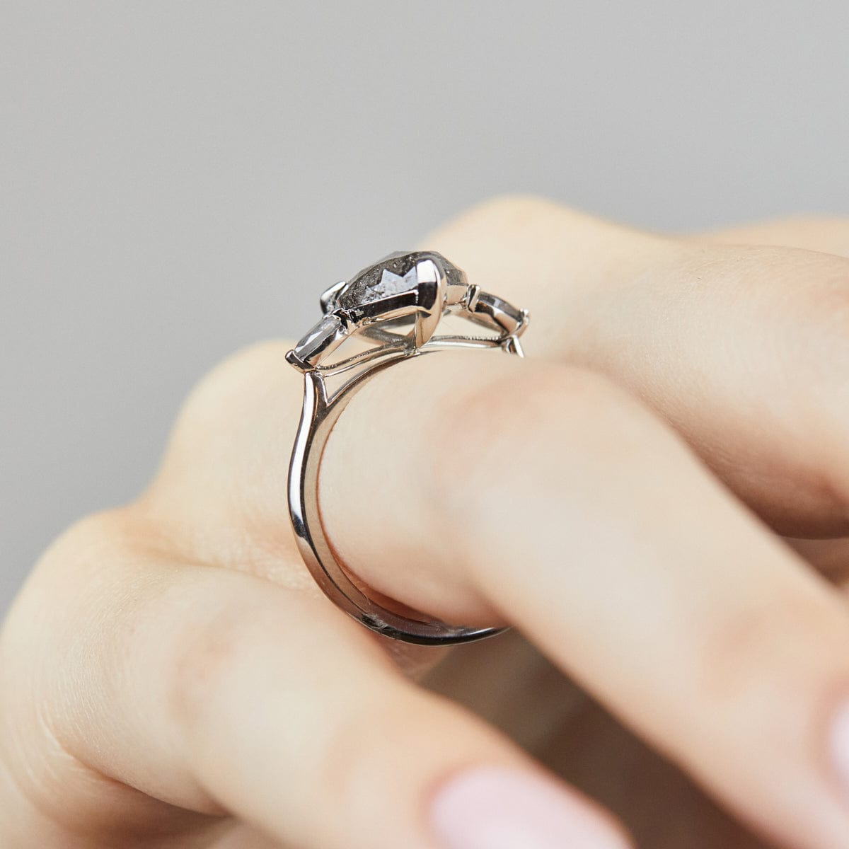 Platinum salt and pepper pear diamond engagement trilogy ring