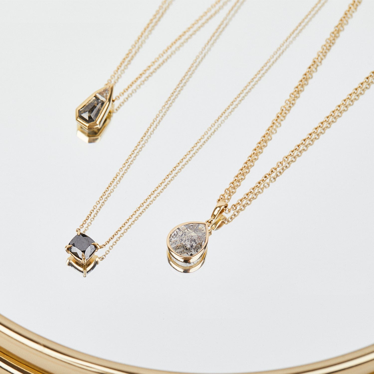 1.45ct pear-shaped salt & pepper diamond necklace in 18ct yellow gold.