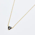 Triangular black diamond necklace in 18ct yellow gold.