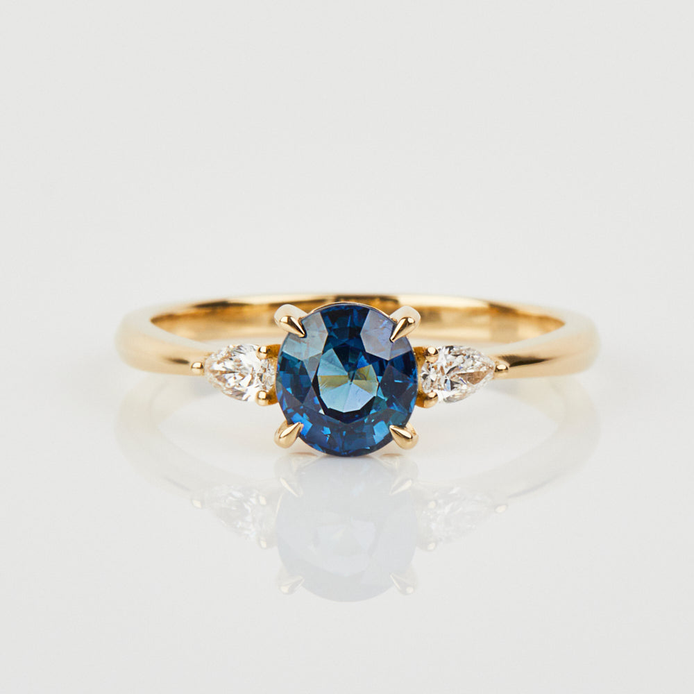 18ct yellow gold oval trilogy ​teal sapphire rings