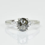 Platinum salt and pepper oval diamond engagement trilogy ring