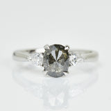 Platinum salt and pepper oval diamond engagement trilogy ring