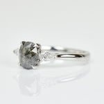 Platinum salt and pepper oval diamond engagement trilogy ring