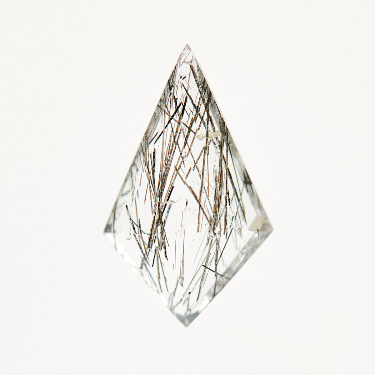 Unique kite-shaped rose-cut rutilated quartz gemstone.