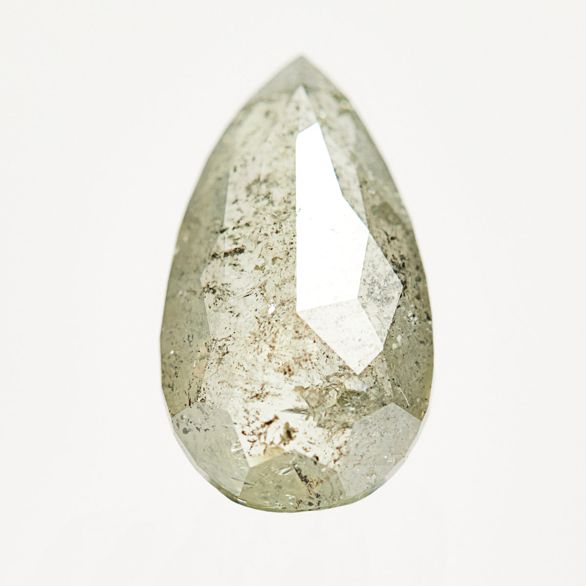 Handcrafted elongated pear-shaped rose-cut light grey salt and pepper diamond.