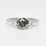 Platinum salt and pepper round brilliant cut diamond engagement trilogy ring