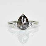 Platinum salt and pepper pear diamond engagement trilogy ring