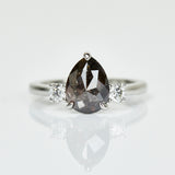Platinum salt and pepper pear diamond engagement trilogy ring