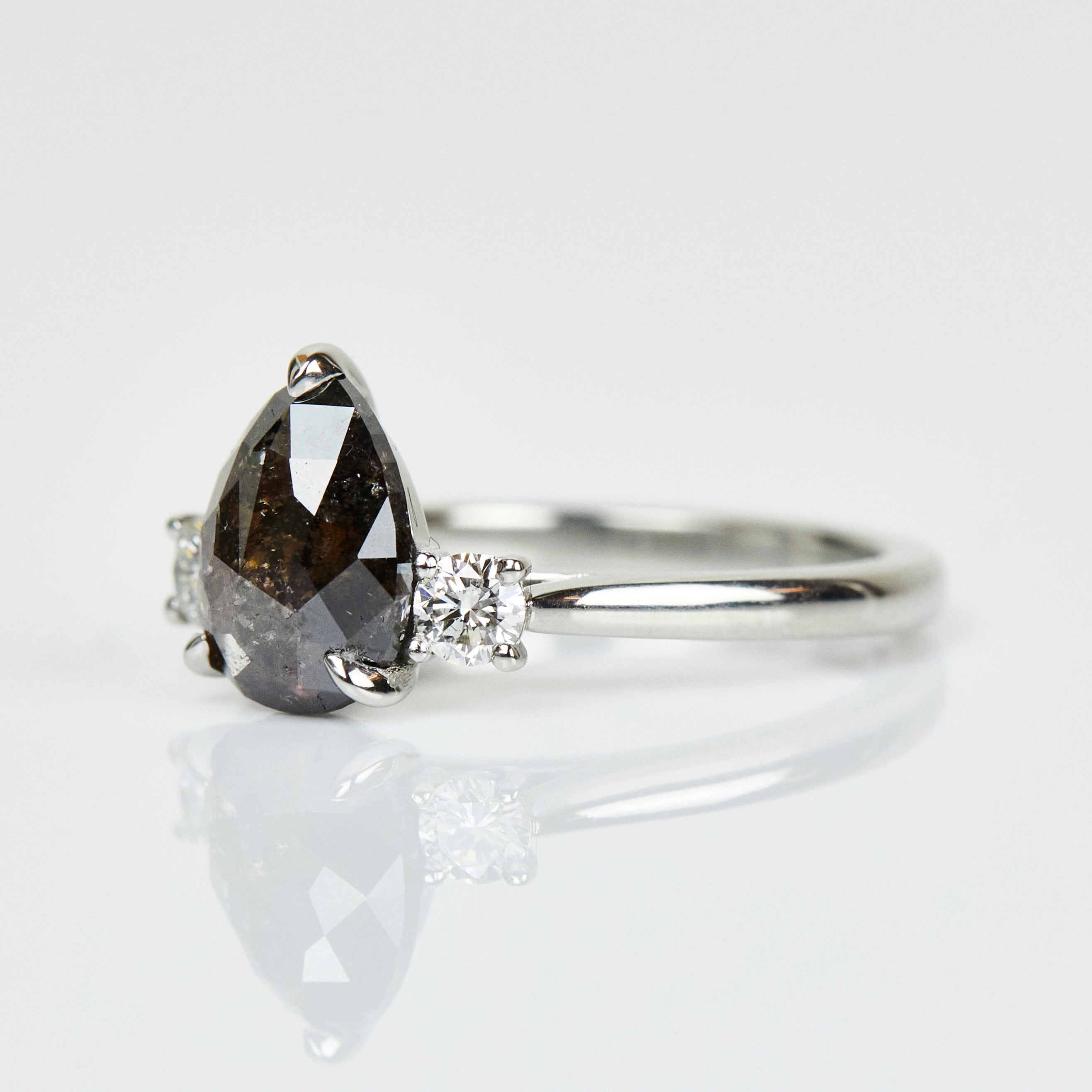 Platinum salt and pepper pear diamond engagement trilogy ring