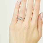 Platinum salt and pepper oval diamond engagement trilogy ring