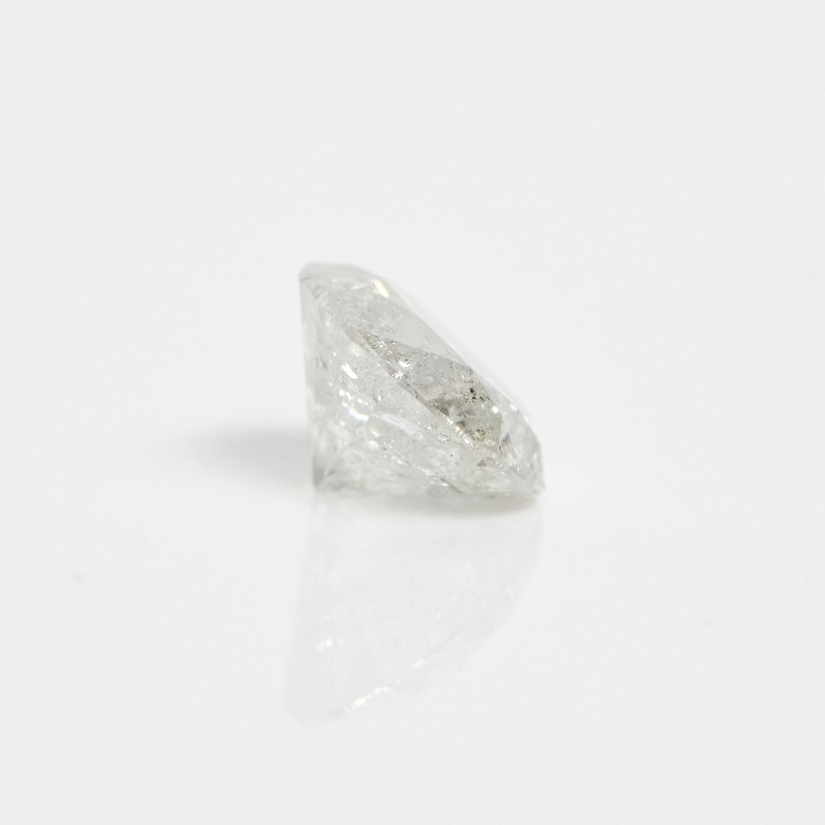 Timeless round brilliant-cut icy white ethically sourced salt and pepper diamond.