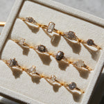 18ct yellow gold salt and pepper oval diamond engagement trilogy ring