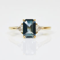 18ct yellow gold emerald cut trilogy ​teal sapphire rings