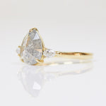 18ct yellow gold salt and pepper pear diamond engagement trilogy ring