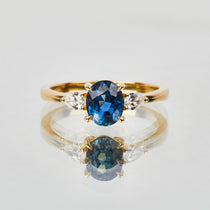 18ct yellow gold oval trilogy ​teal sapphire rings