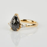 18ct yellow gold salt and pepper pear diamond engagement trilogy ring