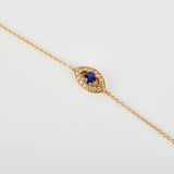 Blue sapphire evil eye bracelet with diamonds in 18ct yellow gold.