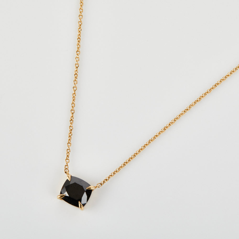 Black cushion cut diamond necklace in 18ct yellow gold.