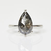 Platinum salt and pepper pear diamond engagement solitaire ring