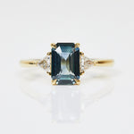 18ct yellow gold emerald cut trilogy ​teal sapphire rings