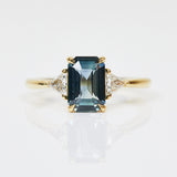 18ct yellow gold emerald cut trilogy ​teal sapphire rings