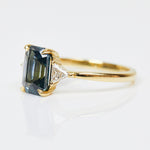 18ct yellow gold emerald cut trilogy ​teal sapphire rings