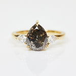 18ct yellow gold salt and pepper pear diamond engagement trilogy ring