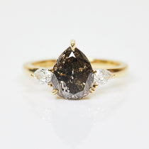 18ct yellow gold salt and pepper pear diamond engagement trilogy ring