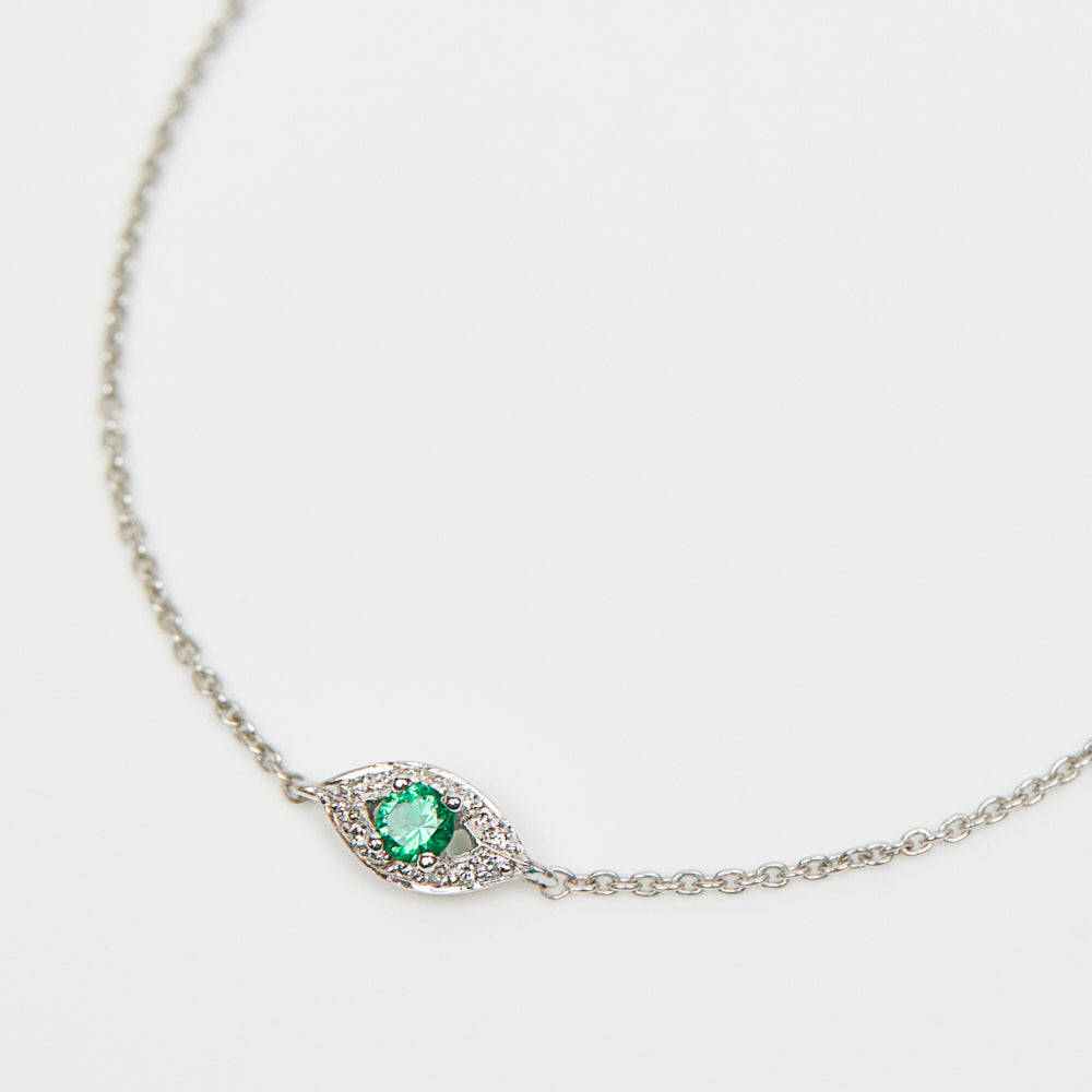 Green sapphire evil eye bracelet with diamonds in 18ct white gold.
