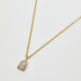 Icy grey shield-shaped diamond necklace in 18ct yellow gold.