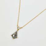 Kite-shaped salt and pepper diamond necklace in 18ct yellow gold.