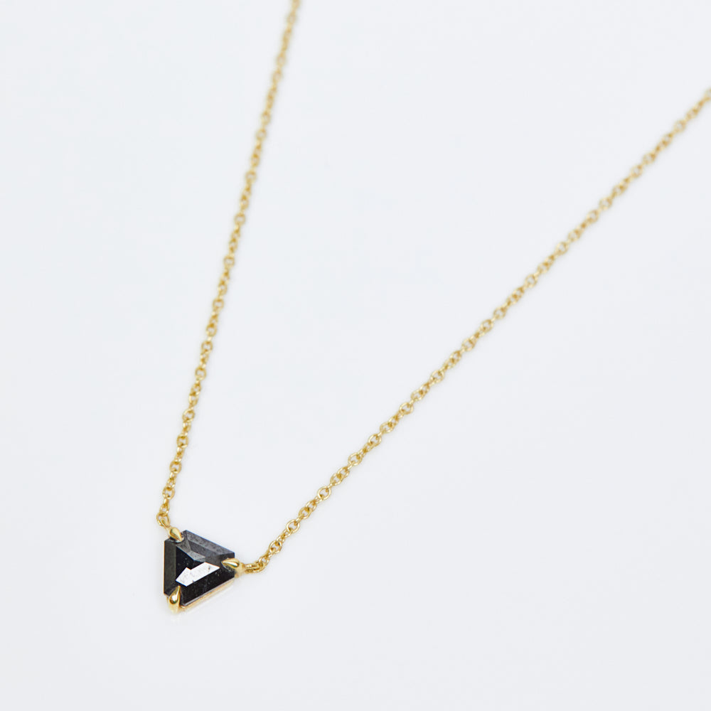 Triangular black diamond necklace in 18ct yellow gold.