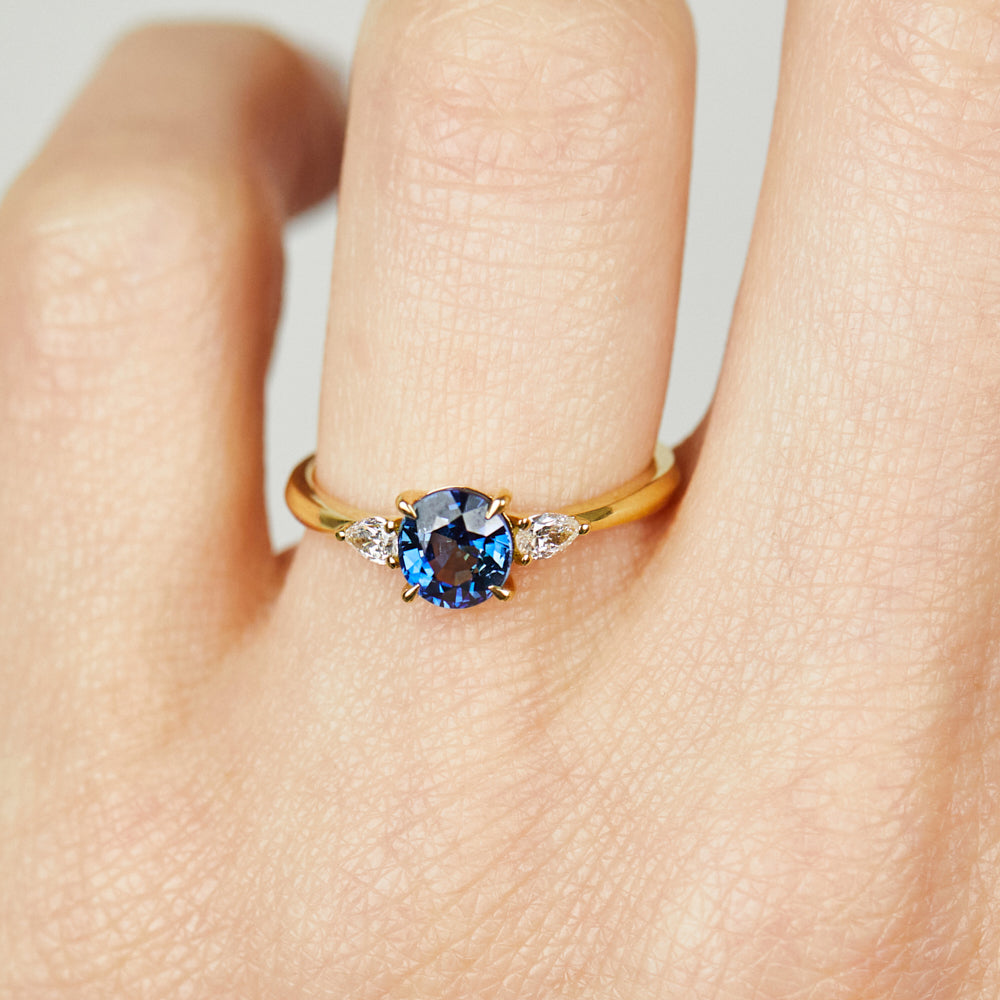 18ct yellow gold oval trilogy ​teal sapphire rings